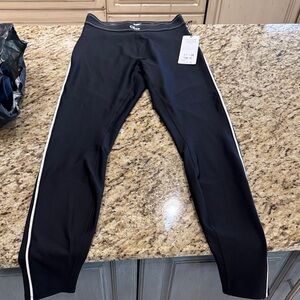 ALO Airlift Yoga Black High-Waist Leggings with White Accents. Purchase for $144